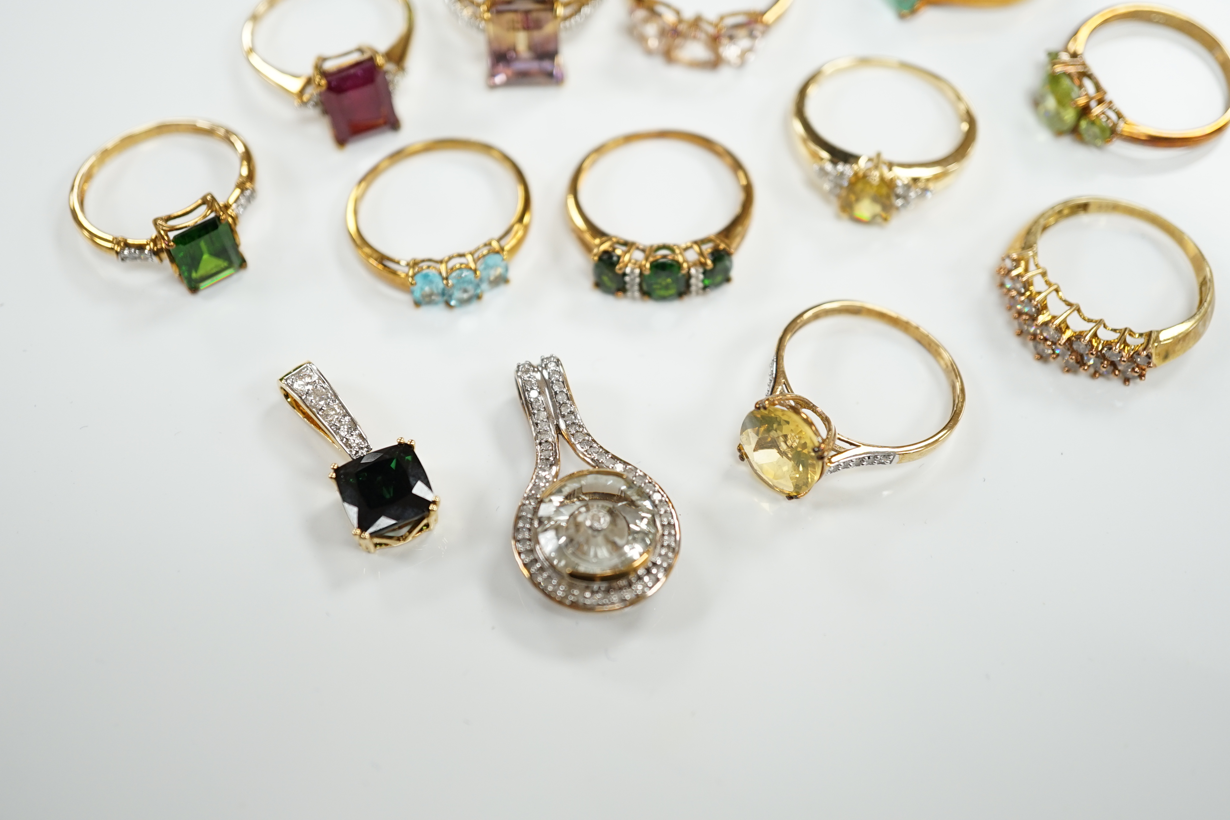 Thirteen assorted modern 9ct gold of 9k and gem set dress rings and a 9ct gold and gem set pendant, gross weight 40.2 grams, together with an 18ct gold, gem and diamond chip set target pendant and an 18ct gold and gem se